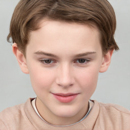 Joyful white child male with short  brown hair and brown eyes