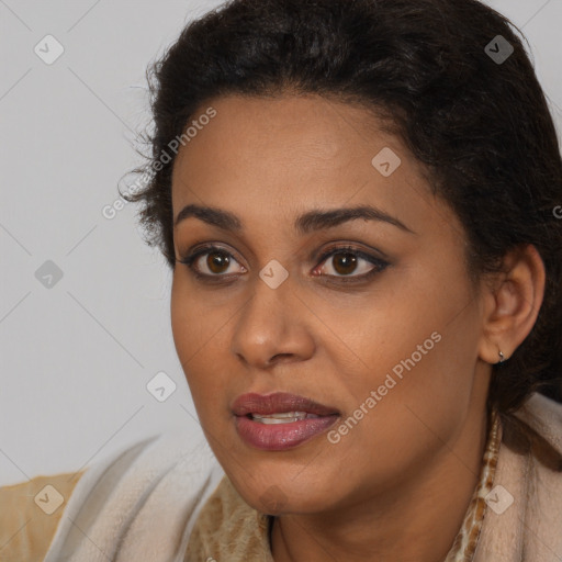 Joyful latino young-adult female with long  brown hair and brown eyes