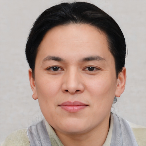 Joyful asian young-adult female with short  brown hair and brown eyes