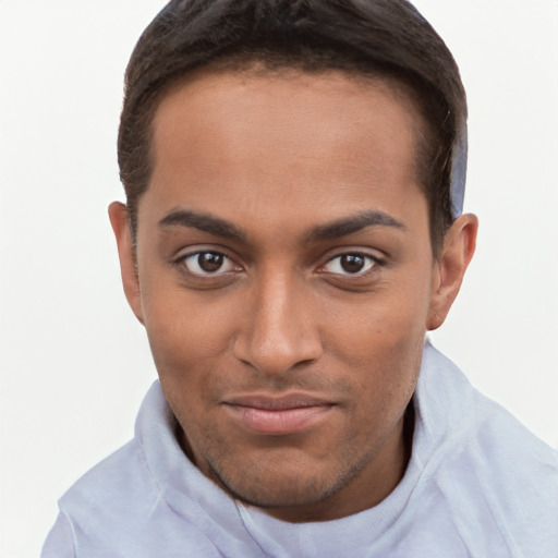 Joyful black young-adult male with short  brown hair and brown eyes