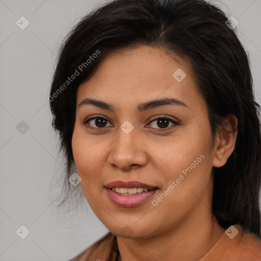 Joyful latino young-adult female with medium  brown hair and brown eyes