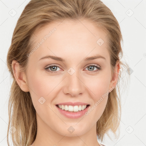 Joyful white young-adult female with long  brown hair and blue eyes