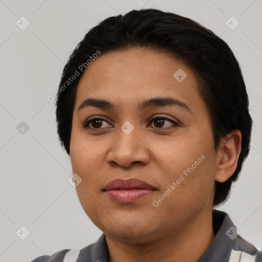 Joyful latino young-adult female with short  black hair and brown eyes