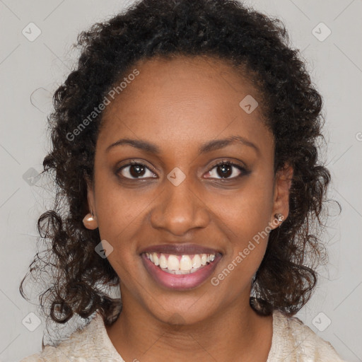 Joyful black young-adult female with long  brown hair and brown eyes