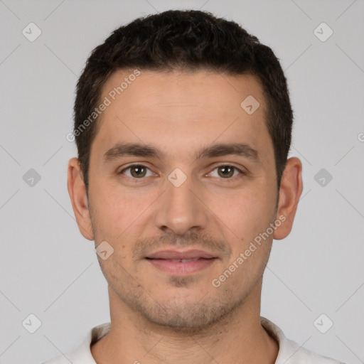 Joyful white young-adult male with short  brown hair and brown eyes