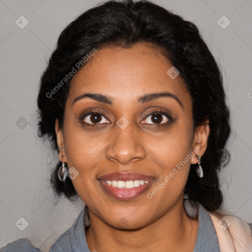 Joyful black young-adult female with long  black hair and brown eyes