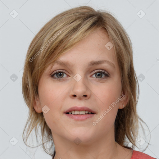 Joyful white young-adult female with medium  brown hair and blue eyes