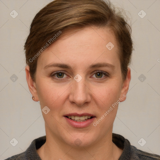 Joyful white young-adult female with short  brown hair and grey eyes