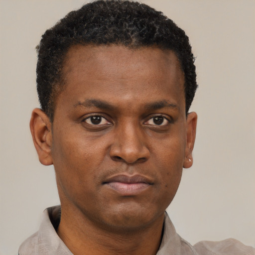 Neutral black young-adult male with short  black hair and brown eyes