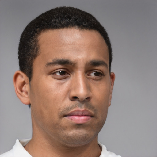 Neutral latino young-adult male with short  brown hair and brown eyes