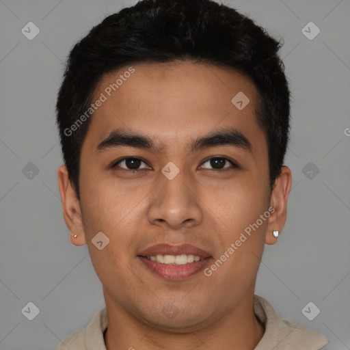 Joyful latino young-adult male with short  brown hair and brown eyes