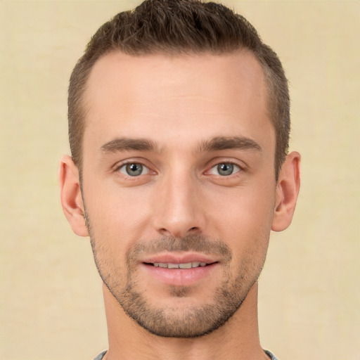 Joyful white young-adult male with short  brown hair and brown eyes