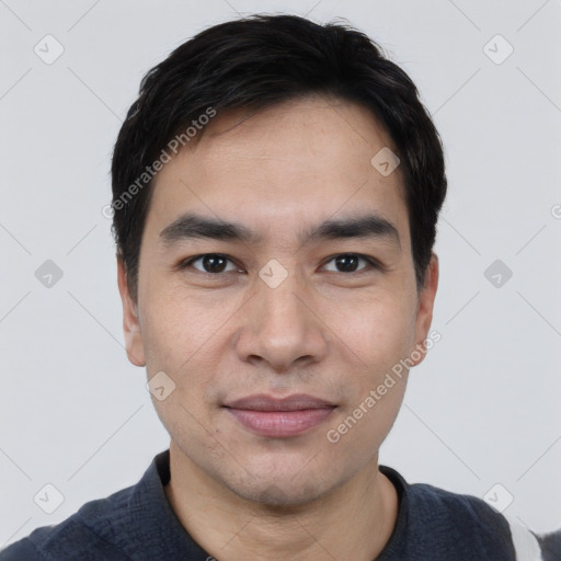 Joyful white young-adult male with short  black hair and brown eyes