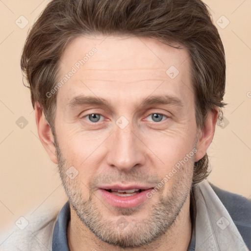 Joyful white adult male with short  brown hair and brown eyes