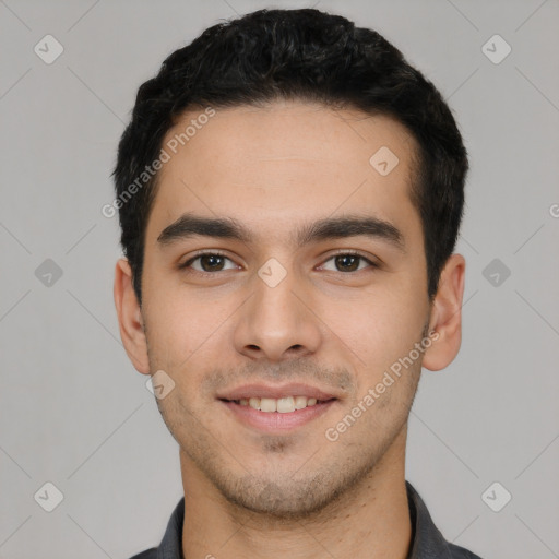 Joyful white young-adult male with short  black hair and brown eyes