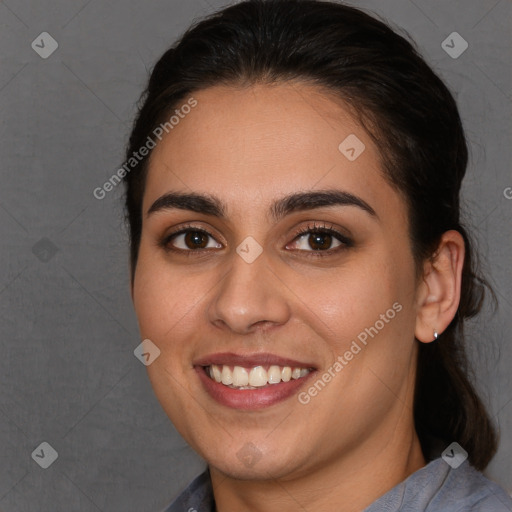 Joyful white young-adult female with long  brown hair and brown eyes