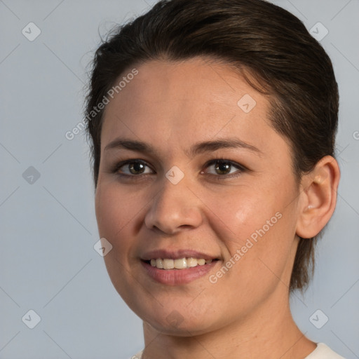 Joyful white young-adult female with medium  brown hair and brown eyes