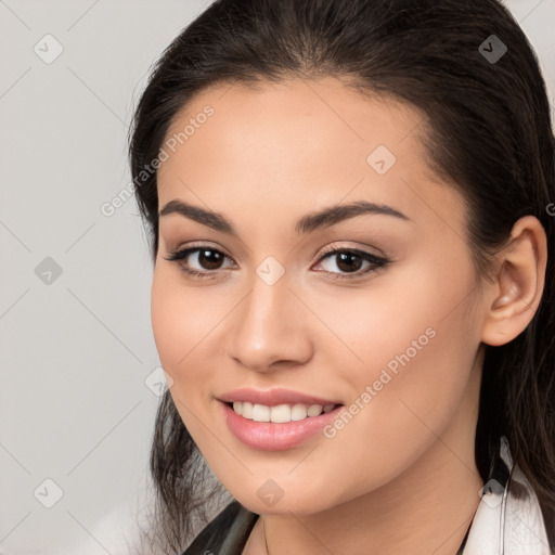 Joyful white young-adult female with long  brown hair and brown eyes