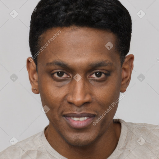 Joyful black young-adult male with short  black hair and brown eyes