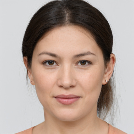 Joyful white young-adult female with medium  brown hair and brown eyes