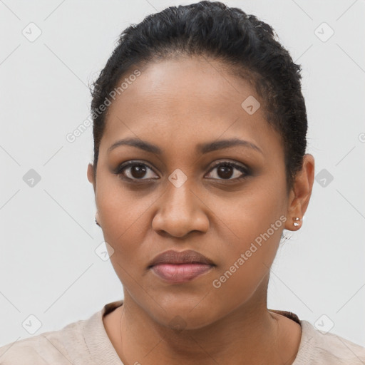 Joyful black young-adult female with short  brown hair and brown eyes