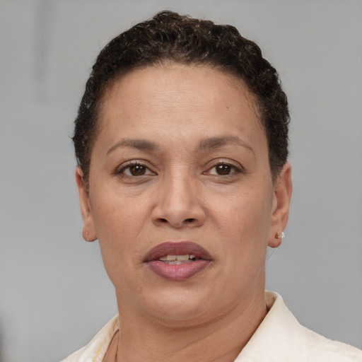 Joyful white adult female with short  brown hair and brown eyes