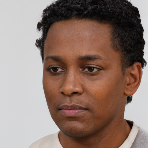 Neutral black young-adult male with short  black hair and brown eyes