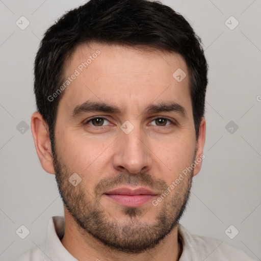 Joyful white young-adult male with short  brown hair and brown eyes