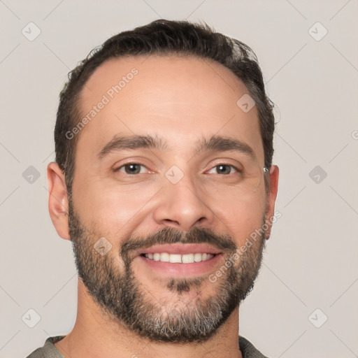 Joyful white young-adult male with short  black hair and brown eyes