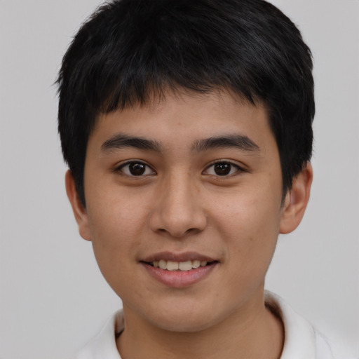 Joyful white young-adult male with short  black hair and brown eyes