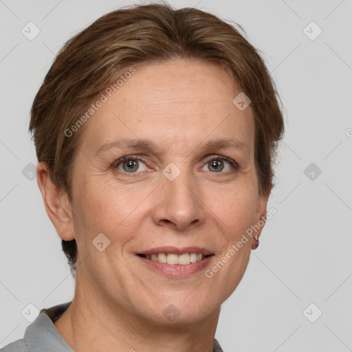 Joyful white adult female with short  brown hair and grey eyes