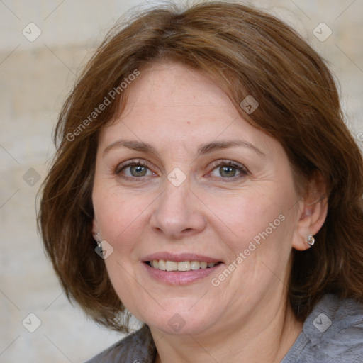 Joyful white adult female with medium  brown hair and grey eyes