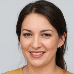 Joyful white young-adult female with medium  brown hair and brown eyes