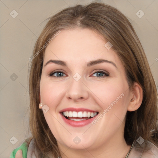 Joyful white young-adult female with medium  brown hair and green eyes