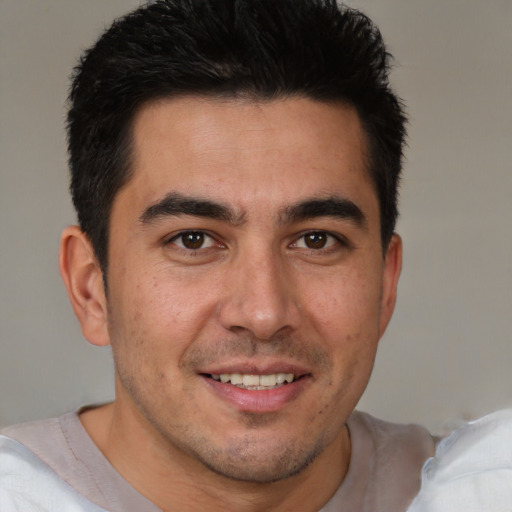Joyful white young-adult male with short  brown hair and brown eyes