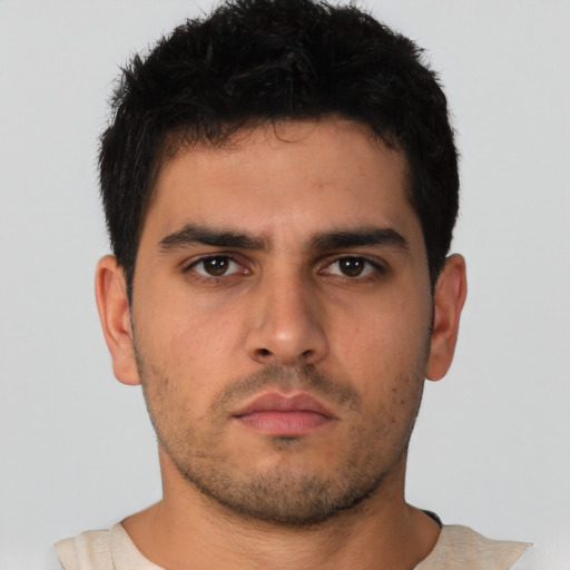 Neutral latino young-adult male with short  brown hair and brown eyes