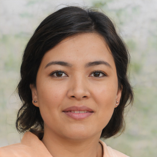 Joyful asian young-adult female with medium  brown hair and brown eyes