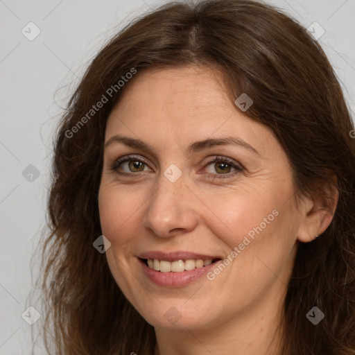 Joyful white adult female with long  brown hair and brown eyes