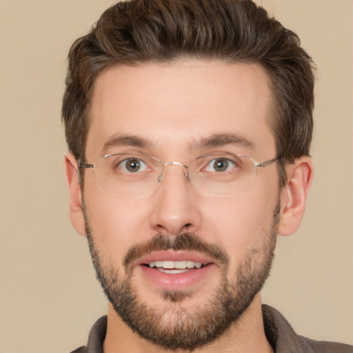 Joyful white adult male with short  brown hair and brown eyes