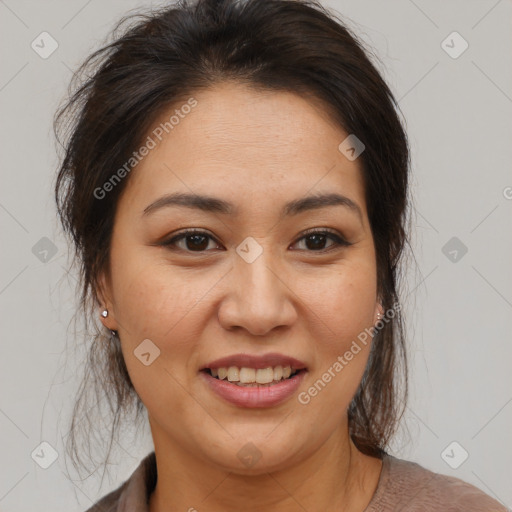 Joyful latino young-adult female with medium  brown hair and brown eyes