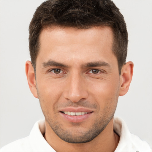 Joyful white young-adult male with short  brown hair and brown eyes