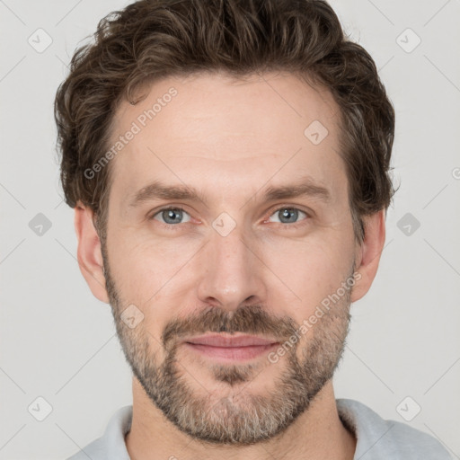 Joyful white adult male with short  brown hair and grey eyes