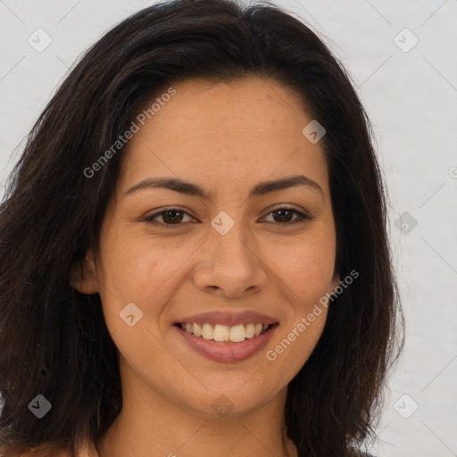 Joyful latino young-adult female with long  brown hair and brown eyes