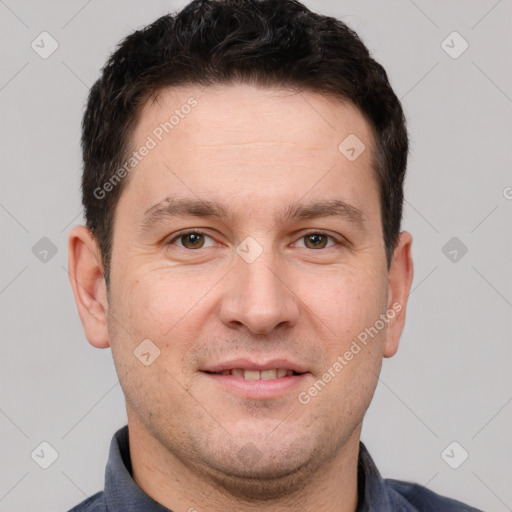 Joyful white adult male with short  brown hair and brown eyes