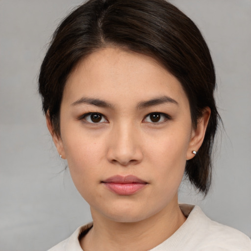 Neutral asian young-adult female with medium  brown hair and brown eyes