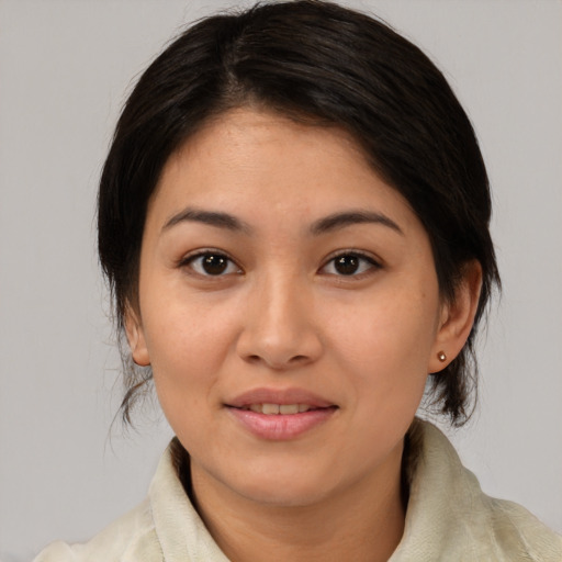 Joyful asian young-adult female with medium  brown hair and brown eyes