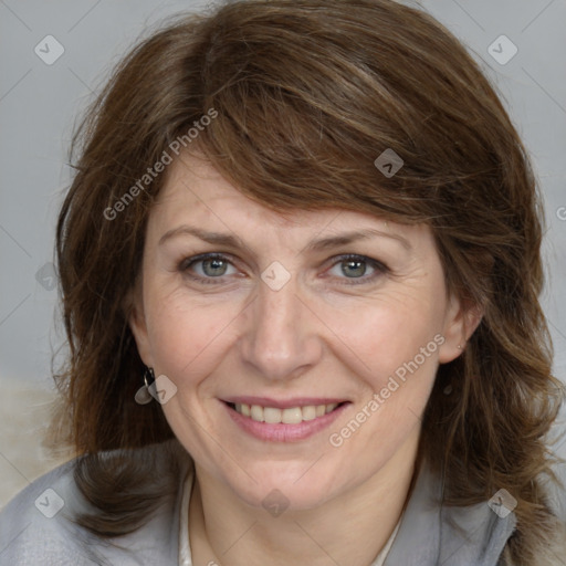 Joyful white adult female with medium  brown hair and grey eyes