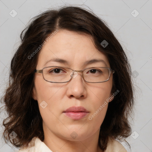 Joyful white adult female with medium  brown hair and brown eyes