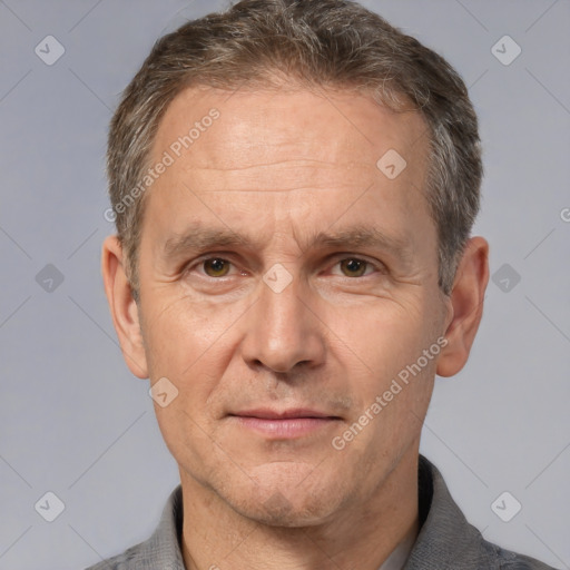 Joyful white middle-aged male with short  brown hair and brown eyes