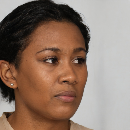 Neutral black young-adult female with short  brown hair and brown eyes